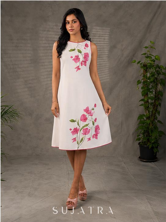 White and pink bougainvillea printed statement dress with pearl embellishments and pink accents