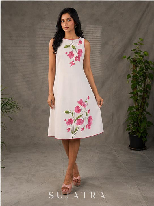 White and pink bougainvillea printed statement dress with pearl embellishments and pink accents