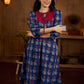 Royal blue Jaipur-printed dress featuring red rose motifs, a pintuck neck patch with red accents, and balloon 3/4th sleeves, creating a graceful silhouette with a blend of artisanal charm and contemporary elegance.