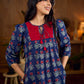 Royal blue Jaipur-printed dress featuring red rose motifs, a pintuck neck patch with red accents, and balloon 3/4th sleeves, creating a graceful silhouette with a blend of artisanal charm and contemporary elegance.