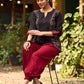 Chic Black Cotton Top Adorned With Geometric Ajrakh Panels And Artistic Hand Painted Highlights