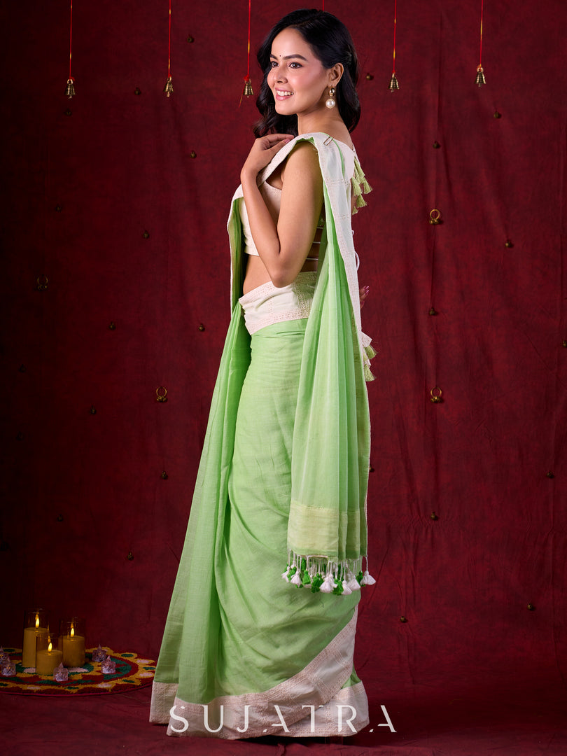 Soft Pastel Green Mul Cotton Saree Adorned with Delicate Hakoba Border & Pallu