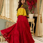 Red tiered Jamdani lehenga with a striking green Ajrakh and mustard jamdani choli featuring intricate mirror work & shell tassels .