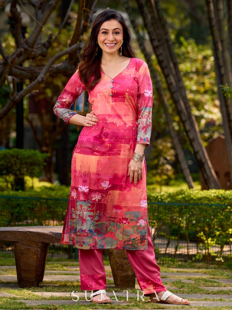 Graceful pink-shaded kurta featuring abstract Pichwai lotus–inspired motifs and a delicate neckline