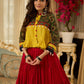 Red tiered Jamdani lehenga with a striking green Ajrakh and mustard jamdani choli featuring intricate mirror work & shell tassels .