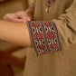 Ethnic dark beige cotton top highlighted with elegant ajrakh detail.