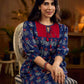 Royal blue Jaipur-printed dress featuring red rose motifs, a pintuck neck patch with red accents, and balloon 3/4th sleeves, creating a graceful silhouette with a blend of artisanal charm and contemporary elegance.