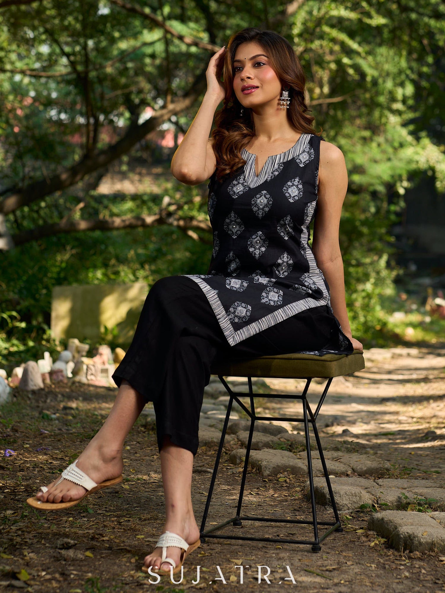 Black viscose sleeveless short kurta elevated with artistic stripe–floral patterns