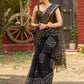 Classic black Kota saree with bold handblock prints and golden borders
