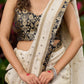 Timeless ivory tissue saree featuring zari embroidery and Banarasi accents
