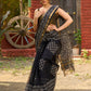 Classic black Kota saree with bold handblock prints and golden borders
