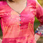 Graceful pink-shaded kurta featuring abstract Pichwai lotus–inspired motifs and a delicate neckline