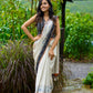 Classic off-white cotton saree with subtle Jamdani-style woven motifs