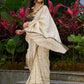 Timeless ivory tissue saree featuring zari embroidery and Banarasi accents
