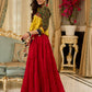 Red tiered Jamdani lehenga with a striking green Ajrakh and mustard jamdani choli featuring intricate mirror work & shell tassels .