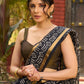 Classic black Kota saree with bold handblock prints and golden borders