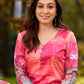 Graceful pink-shaded kurta featuring abstract Pichwai lotus–inspired motifs and a delicate neckline