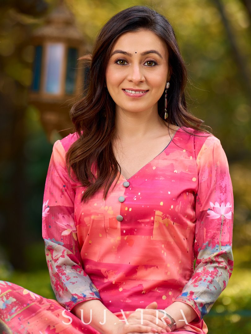 Graceful pink-shaded kurta featuring abstract Pichwai lotus–inspired motifs and a delicate neckline