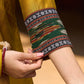 Mustard Cotton Silk Top With Pleated Yoke And Contrasting Ikat Detailing On Sleeves And Collar