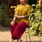 Mustard Cotton Silk Top With Pleated Yoke And Contrasting Ikat Detailing On Sleeves And Collar
