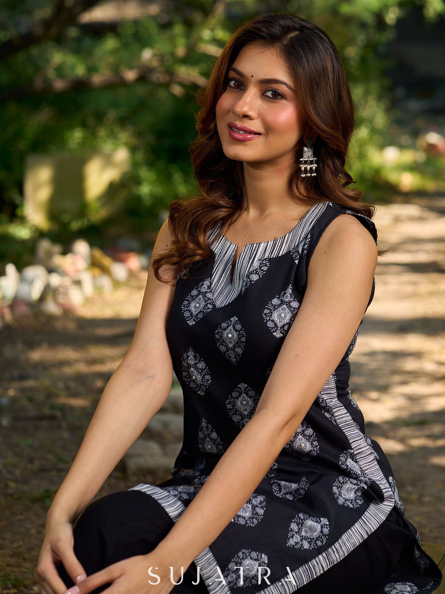 Black viscose sleeveless short kurta elevated with artistic stripe–floral patterns