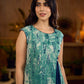 Indigo printed dress featuring playful fish motifs, designed in a gathered side-panel silhouette with contrast navy blue accents, creating a fluid, contemporary look with refined artisanal charm.