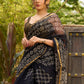 Classic black Kota saree with bold handblock prints and golden borders