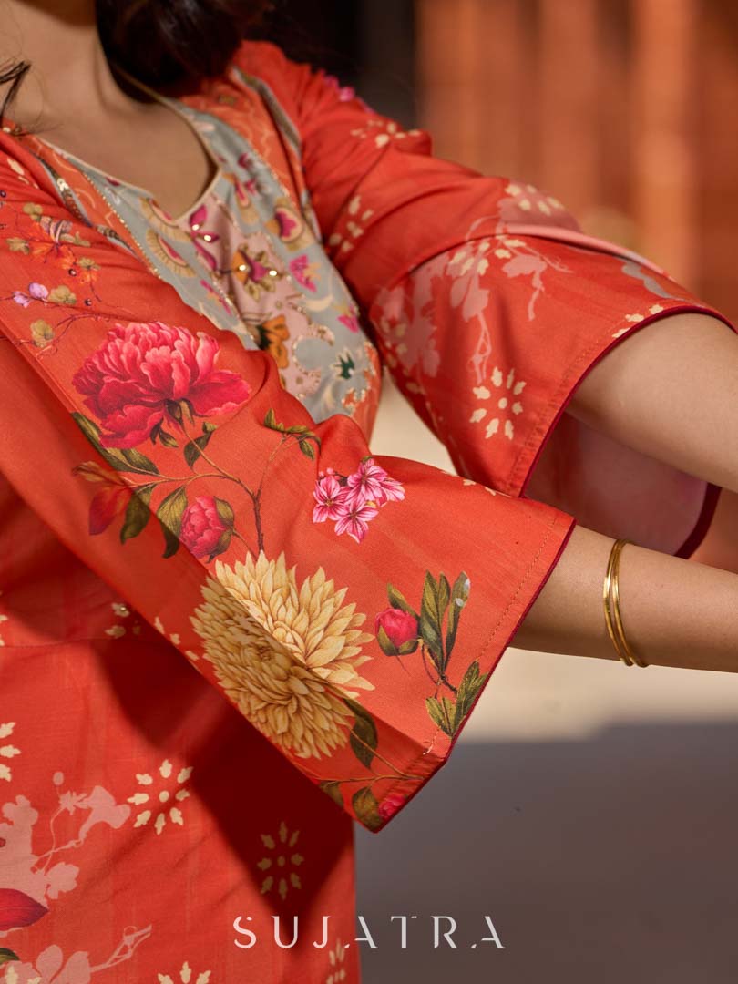 Elegant orange floral printed kurta with hand-embroidered sequin and cut dana detailing on the yoke and rich maroon accents.