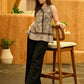 Grey Bloom Mul Cotton Sleeveless Wrap Top with Golden Accents and A-line Flare