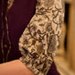 Playful purple cotton dress showcasing floral puff sleeves and box pleats released from the dart for soft volume and flow