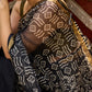 Classic black Kota saree with bold handblock prints and golden borders