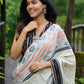 Classic off-white cotton saree with subtle Jamdani-style woven motifs