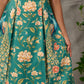Green peacock motif printed dress with straight neckline and orange accents