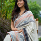 Classic off-white cotton saree with subtle Jamdani-style woven motifs