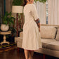 White and black striped dress with Kalamkari panel and tie-up neckline.