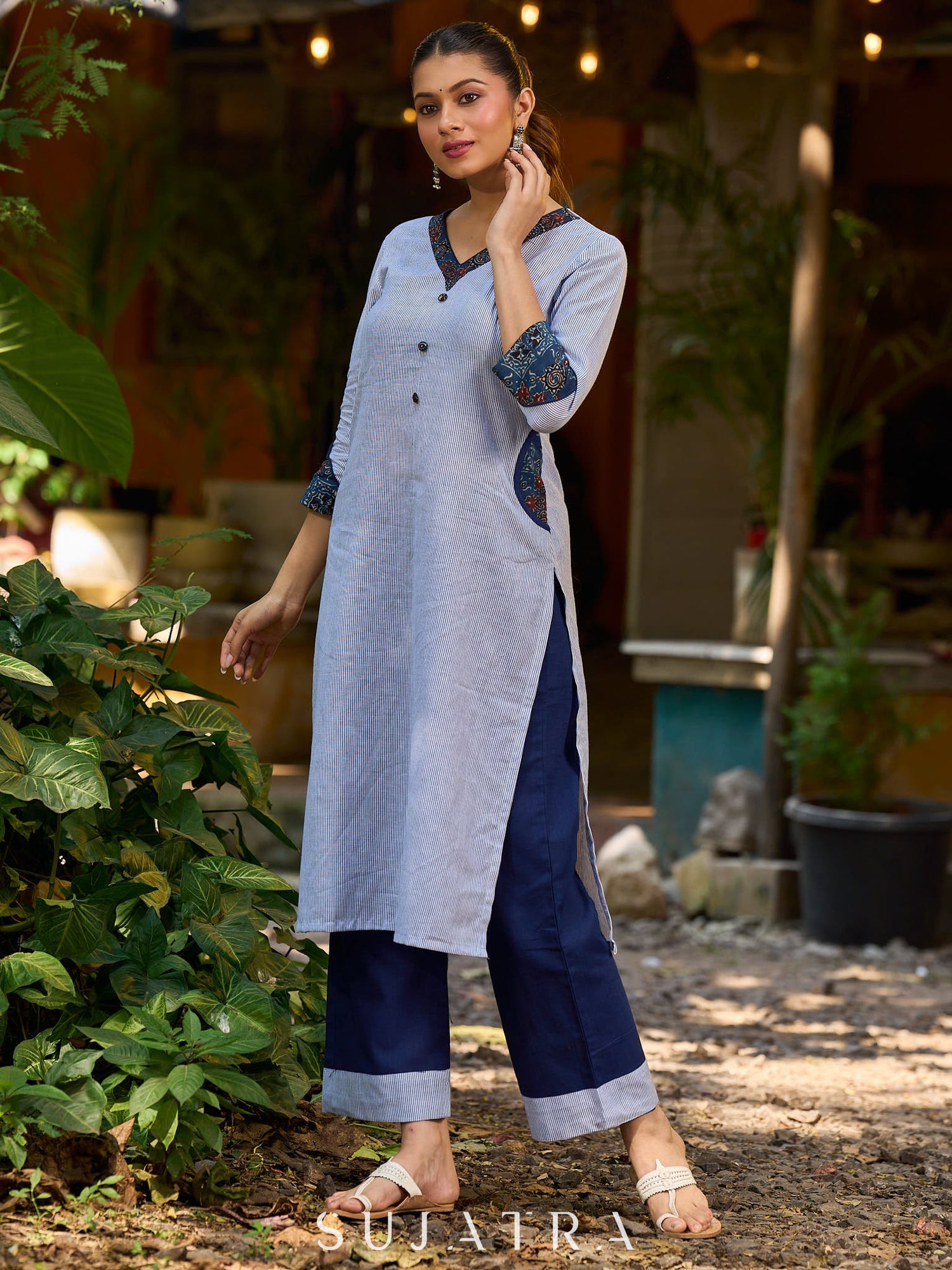 chic blue striped kurta adorned with peeking ajrakh accents on the pocket and sleeves.