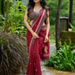 Artisanal maroon Jamdani saree elevated with zari-bordered detailing