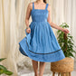 Flowy blue cotton dress with intricate block print and artistic detailing
