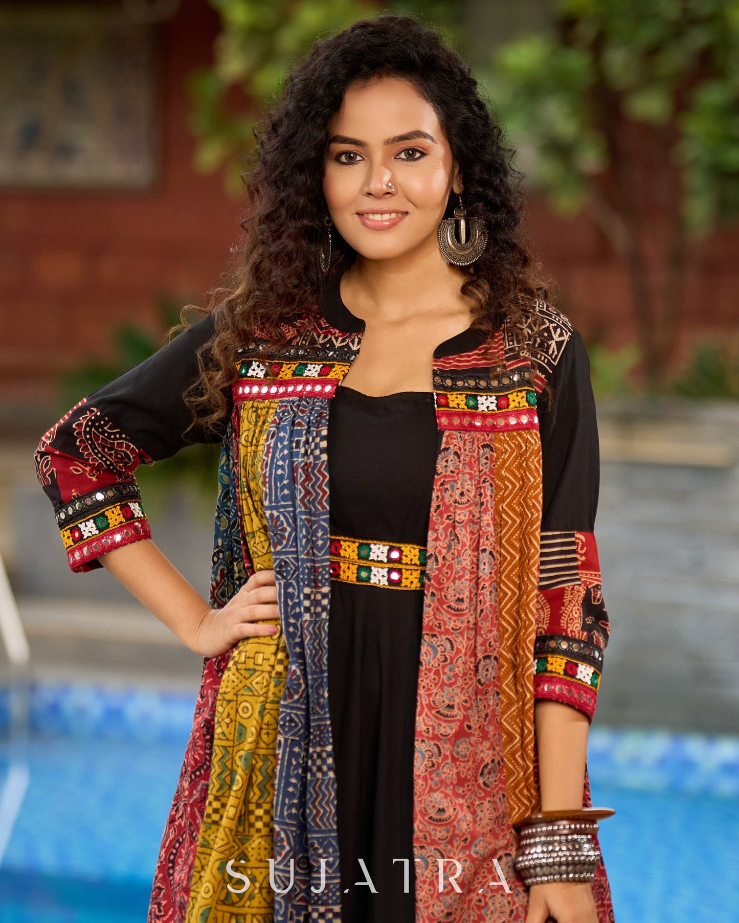 Black Rayon Double-Flared Sleeveless Dress with Mirror Work Embellishments  -  Patchwork Ajrakh Jacket Additional