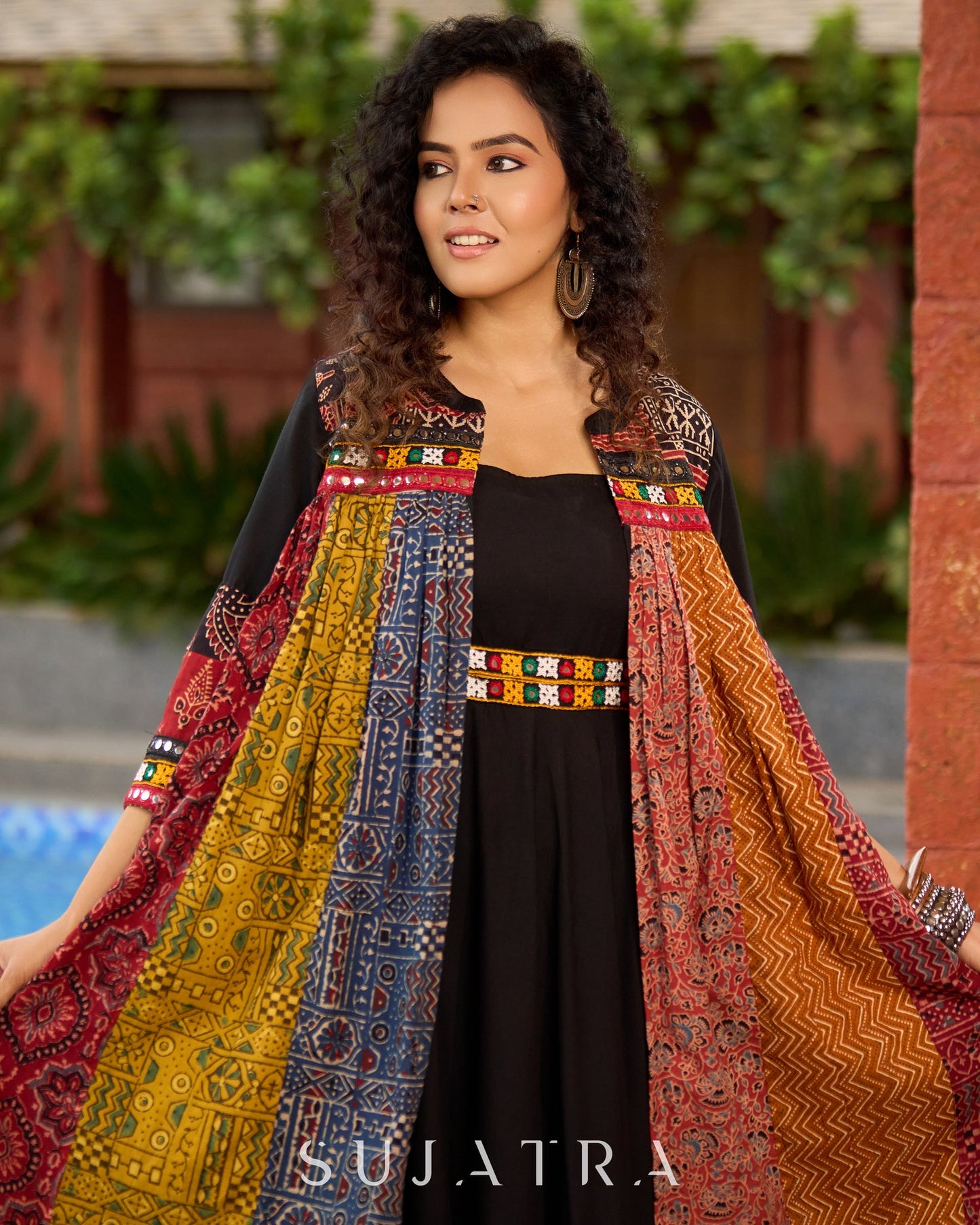 Black Rayon Double-Flared Sleeveless Dress with Mirror Work Embellishments  -  Patchwork Ajrakh Jacket Additional