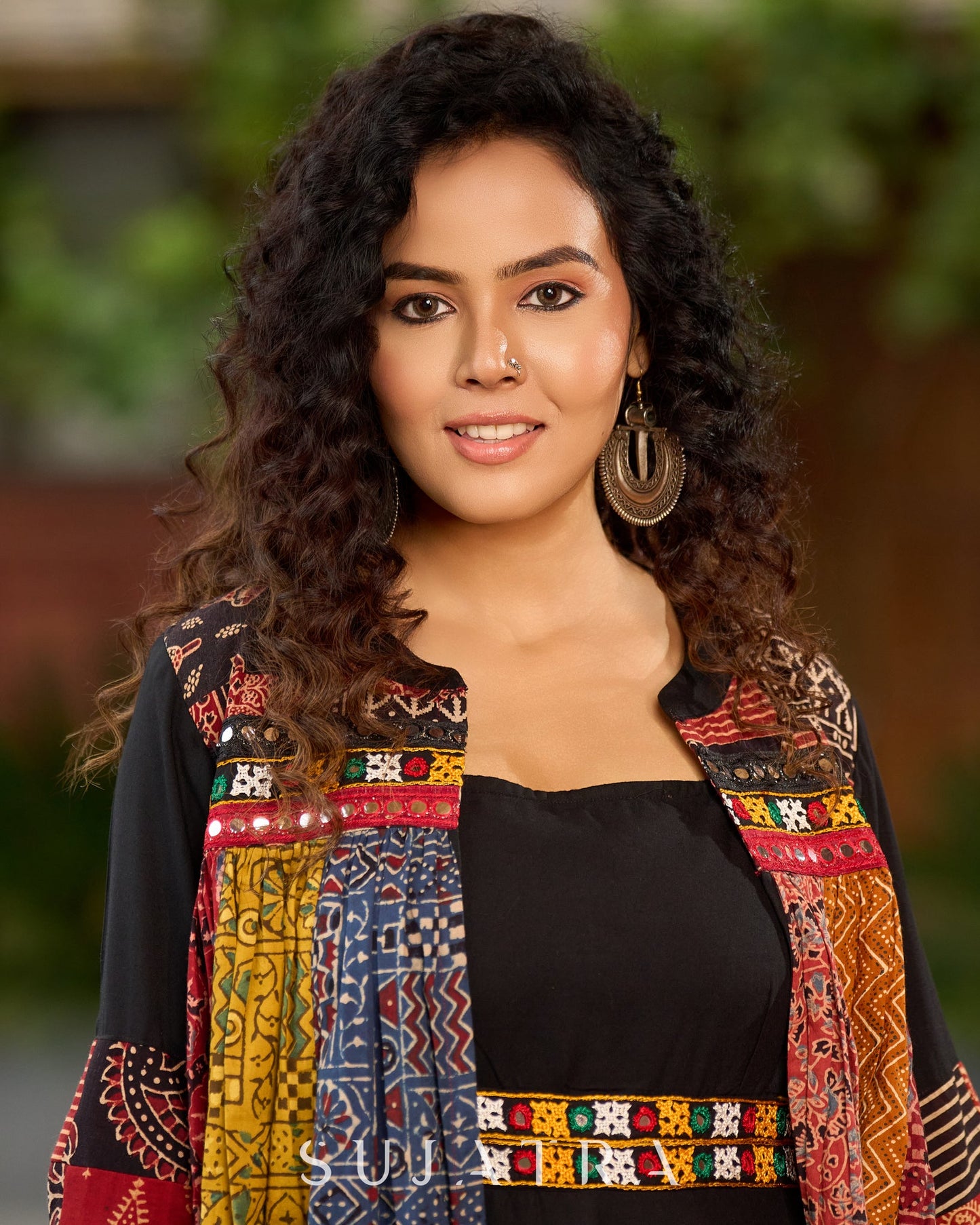 Black Rayon Double-Flared Sleeveless Dress with Mirror Work Embellishments  -  Patchwork Ajrakh Jacket Additional