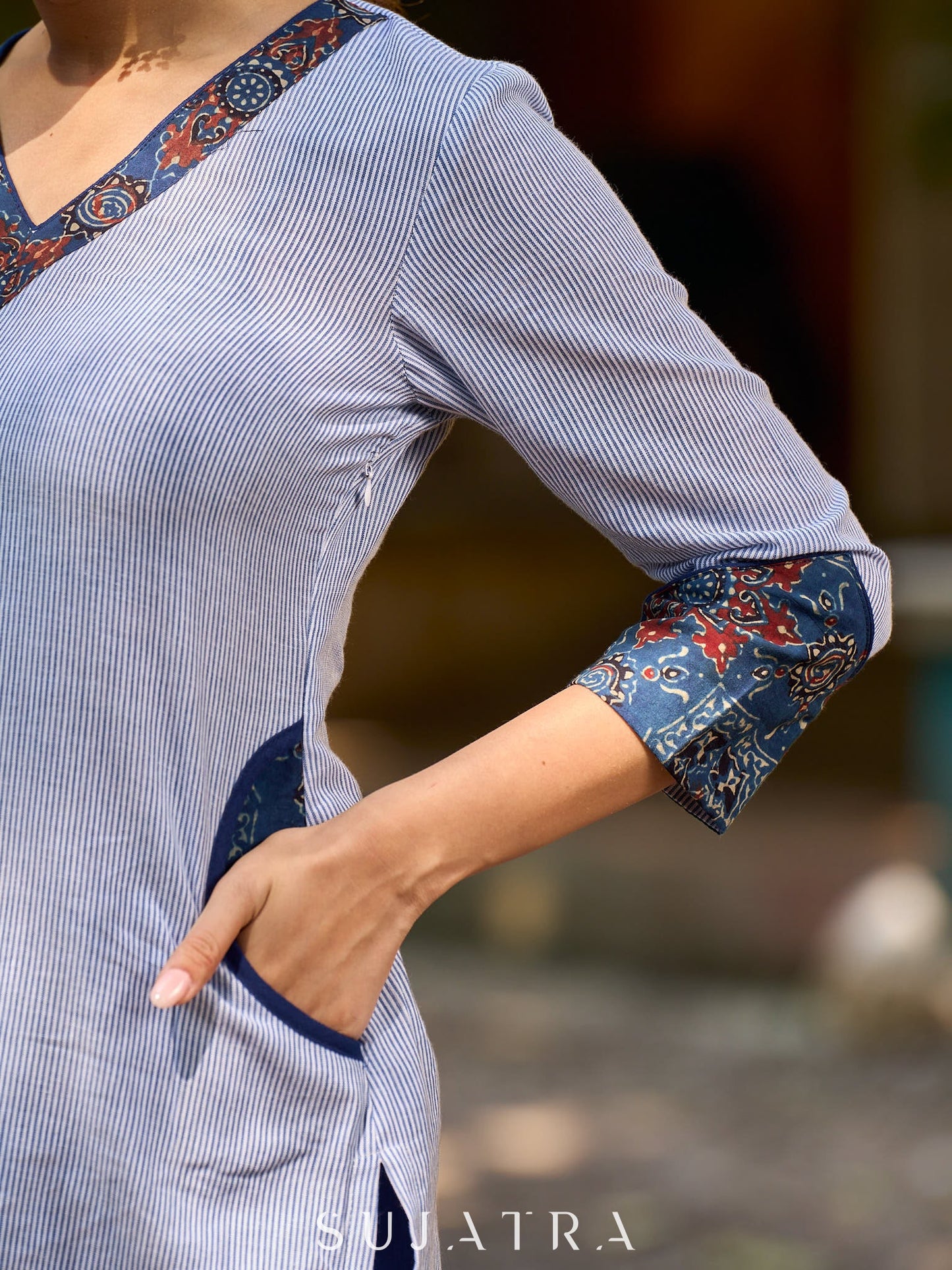 chic blue striped kurta adorned with peeking ajrakh accents on the pocket and sleeves.