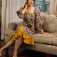 Heritage Kalamkari dress with elegant mustard accents and black pearl embellishments.