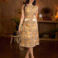Summery mustard and peach floral sleeveless dress featuring a boat neckline and Hakoba pocket detailing, finished with soft off-white accents for a breezy, cheerful silhouette perfect for warm days.