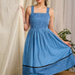 Flowy blue cotton dress with intricate block print and artistic detailing