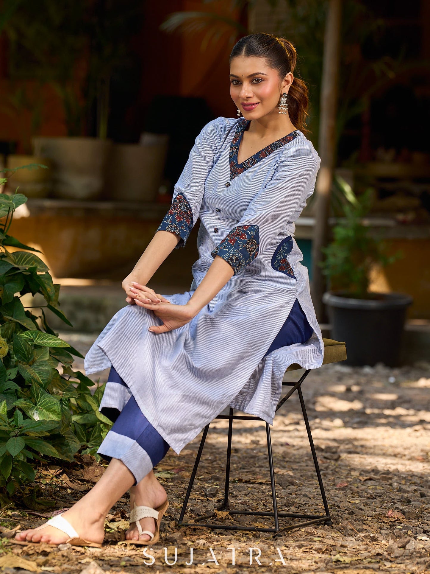 chic blue striped kurta adorned with peeking ajrakh accents on the pocket and sleeves.