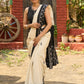 Ivory cotton saree with bold block embroidered motifs and refined contrast detailing