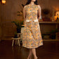 Summery mustard and peach floral sleeveless dress featuring a boat neckline and Hakoba pocket detailing, finished with soft off-white accents for a breezy, cheerful silhouette perfect for warm days.