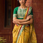 Exquisite Mustard Bandhani Print Saree with Green Benarasi Border & Tasseled Pallu with Hand Embroidered Mirror Work