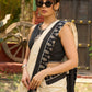 Ivory cotton saree with bold block embroidered motifs and refined contrast detailing